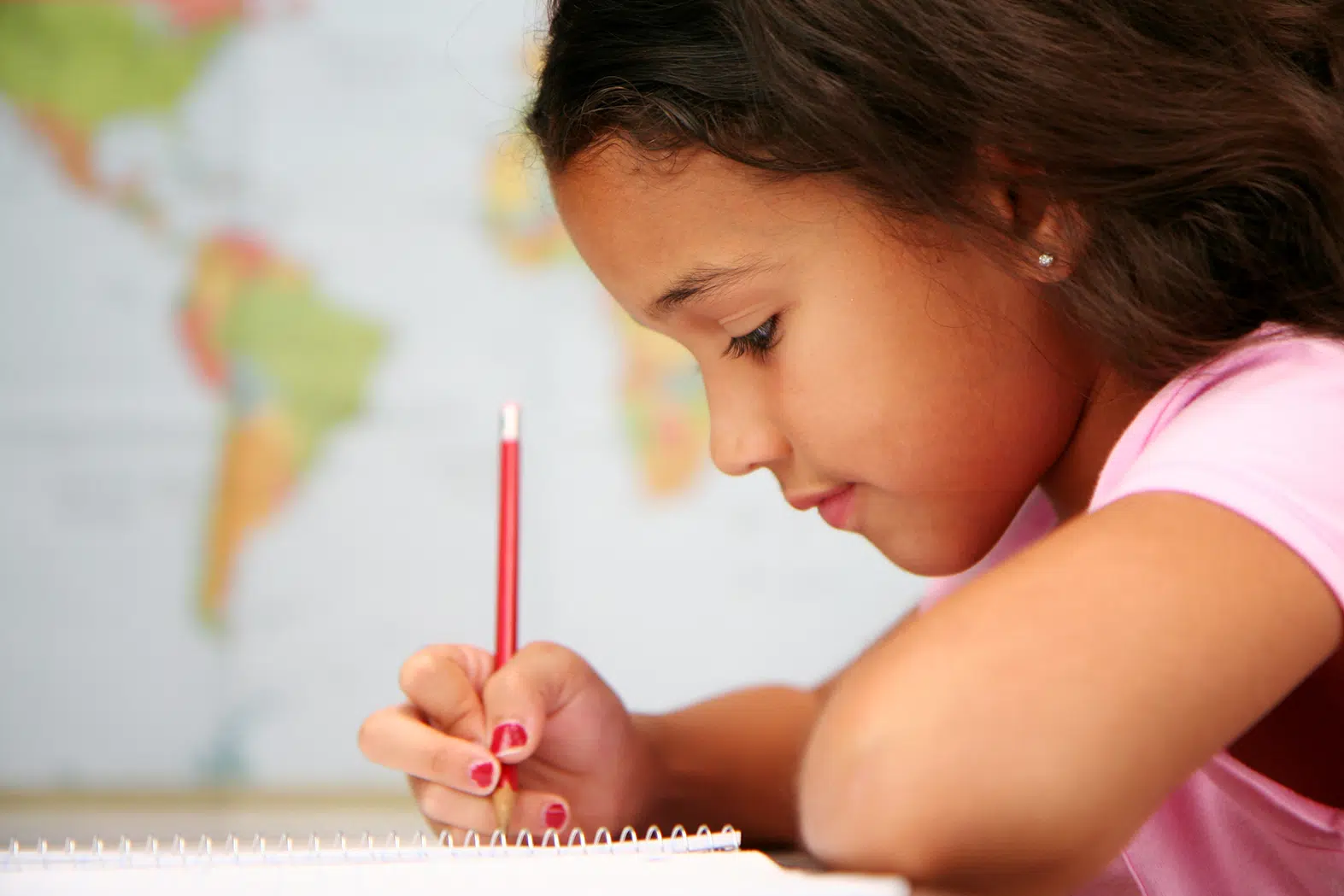 An elementary aged girl learning to study during her private tutoring services
