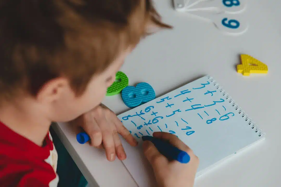 focused child doing math homework