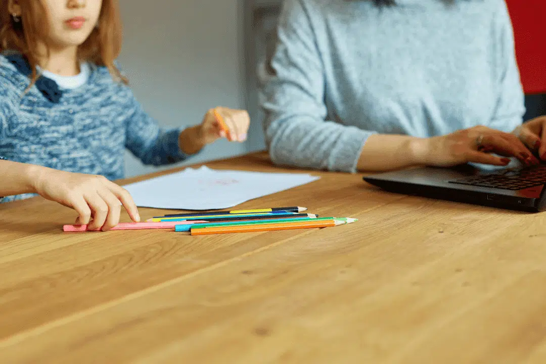 student studying at home with parent during test prep tutoring session